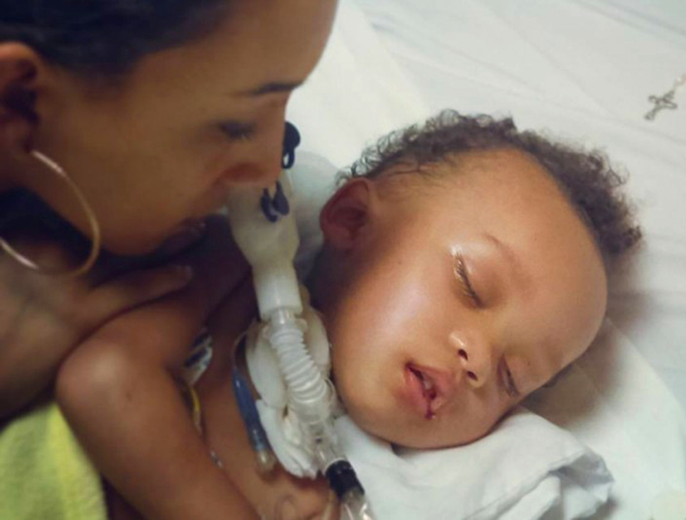 Jonee Fonseca with her son Israel Stinson while he was on life support. The toddler died Thursday.
