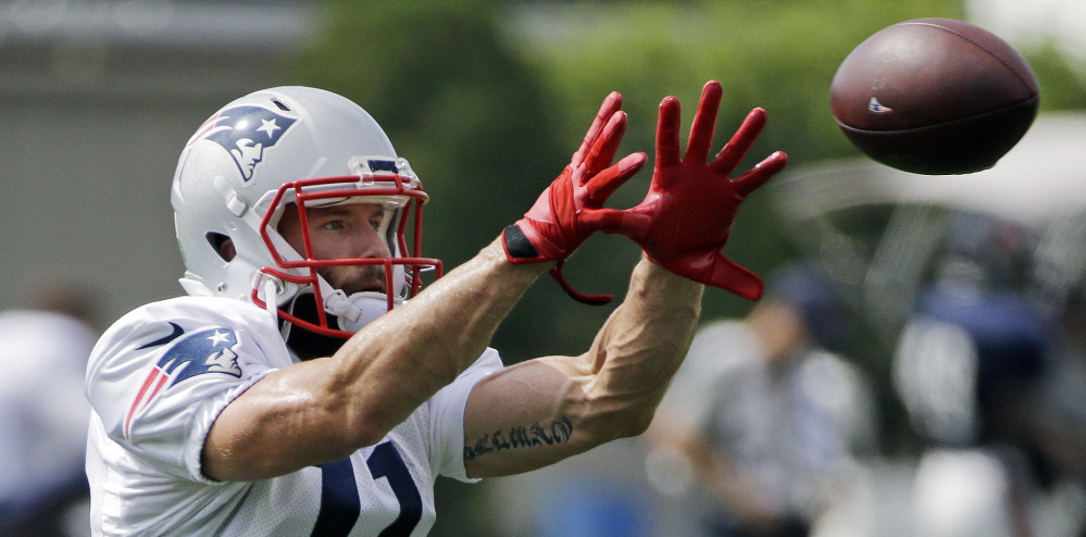 New England Patriots wide receiver Julian Edelman catches a pass during training camp Aug. 16 in Foxborough, Mass. 
