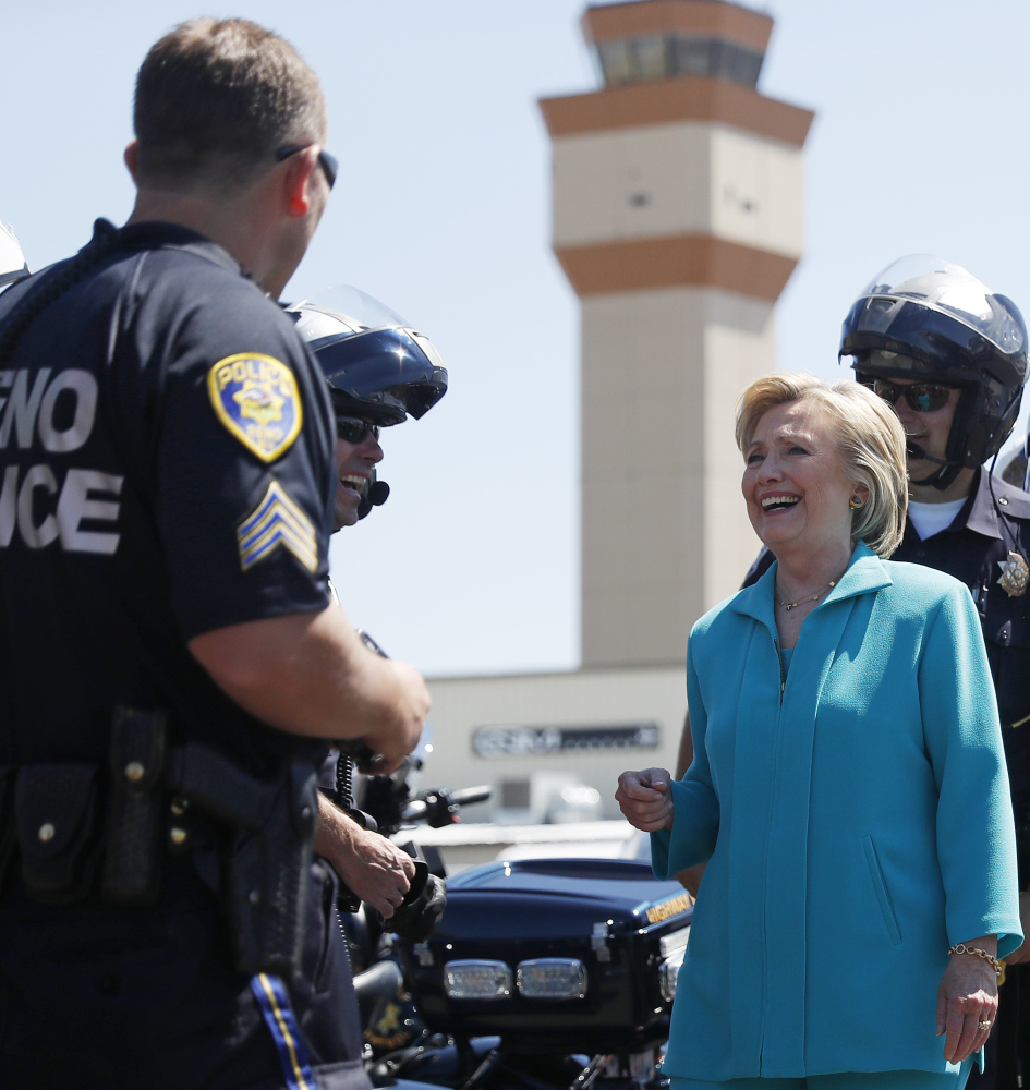 Hillary Clinton talks with police in Reno, Nev., last week. She is, by all accounts, rehearsing diligently for her upcoming confrontation with Donald Trump – so much that some in her camp worry that she may drown herself in detail to the detriment of her performance.