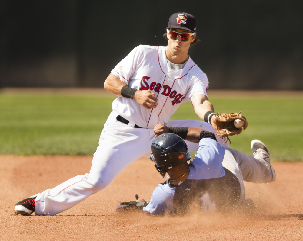 Sea Dogs second baseman Ryan Court is late with the tag as Trenton Thunder's Jose Rosario slides safely into second with a stolen base. The Sea Dogs lost lost to the Thunder 4-3 in 11 innings at Hadlock Field in Portland on Sunday.