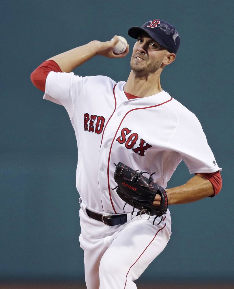 Red Sox starting pitcher Rick Porcello delivers against the Tampa Bay Rays in the first inning Monday night at Fenway Park. Porcello pitched seven innings and won his 18th game of the season.