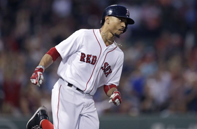 Mookie Betts rounds first base on his solo home run in the second inning, his 30th home run of the season.