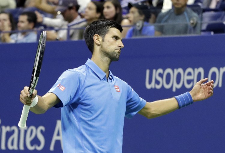 Novak Djokovic said he didn't want to talk about his health, but it was evident that his right arm was a bother Monday night during a four-set victory against Jerzy Janowicz of Poland as the U.S. Open began.
