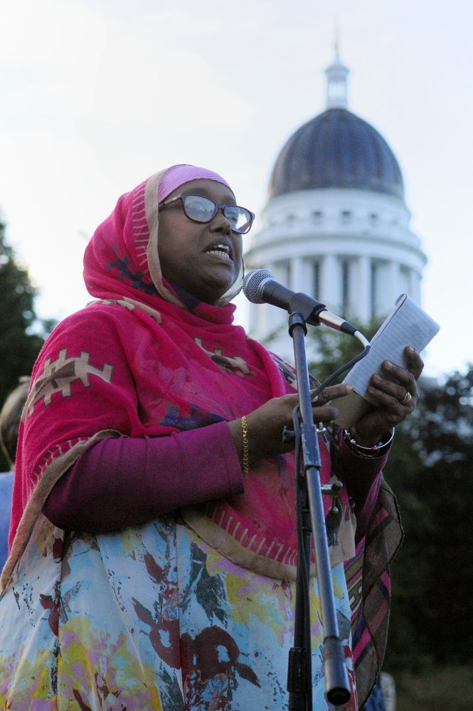 Daqa Dhalac of Lewiston speaks at Tuesday's rally in Capitol Park. She said that as the black, Muslim mother of two sons and a daughter, she fears for their lives.