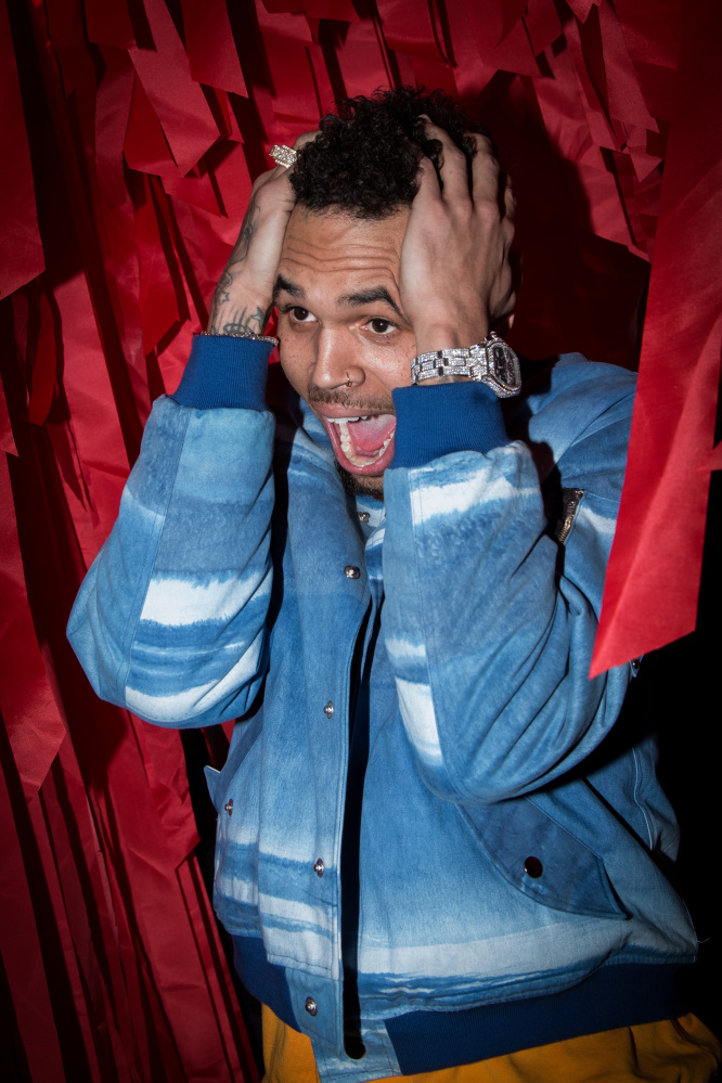 Chris Brown poses for photographers before departing the L'Oreal Red Obsession Party in Paris, Tuesday, March 8, 2016. (AP Photo/Vianney le Caer)