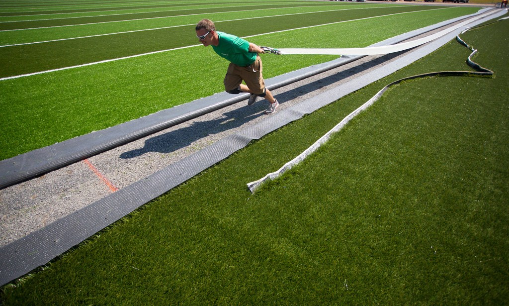 After a Decade of Play, University of Maine Replace Football Field with New  FieldTurf - FieldTurf