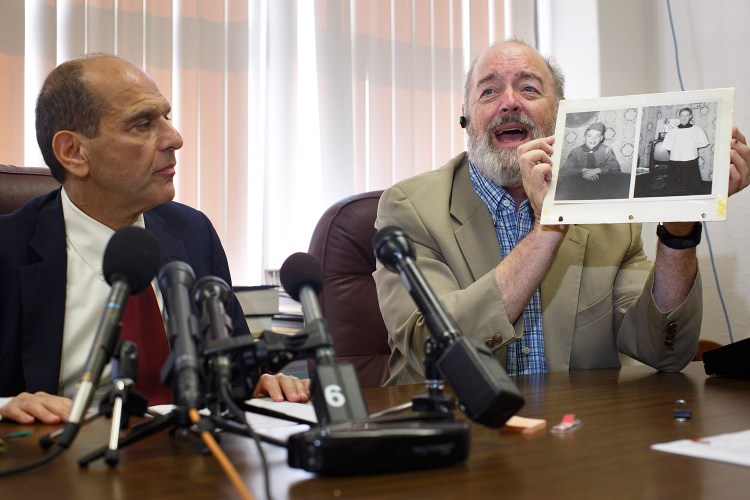 Attorney Mitchell Garabedian, left, with victim Lawrence Gray who was abused beginning in 1958. Gray spoke during the press conference and showed a picture of himself around the ages of 11 or 12.