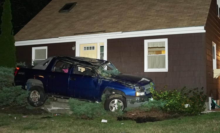 Police searched Friday night for the man who crashed this Chevrolet SUV into a house in Yarmouth after a police chase.
Photo by Tom Bell