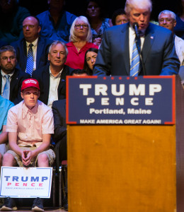 Connor Mullen, a South Portland High School student who said students and staff members at the school ridiculed him for wearing a "Make America great again" hat, got a seat on the stage for Donald Trump's rally in Portland. Derek Davis/Staff Photographer