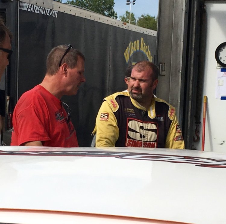 Johnny Clark of Hallowell, right, talks about his car's performance with Joel Tozier during a practice session for the Pro All Stars Series race at Oxford Plains Speedway in on Aug. 1. The six-time series champion seeks his first Oxford 250 win this Sunday.  Travis Barrett/Kennebec Journal