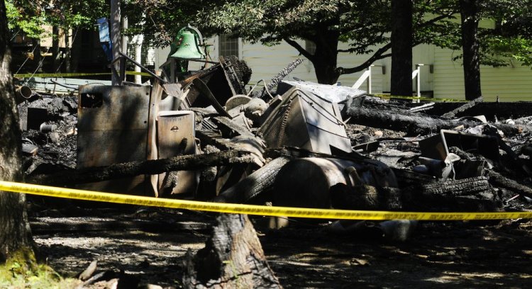 Six buildings at the site of the Washington Advent Christian Camp, including a two-story dormitory, were destroyed in a fire Monday. More than 50 buildings are part of the property and the camp association plans to rebuild. 
