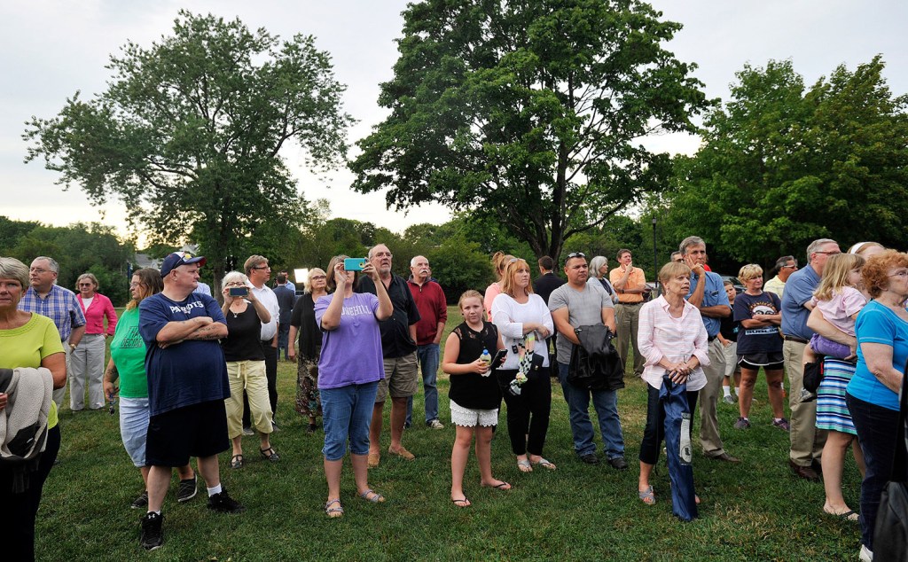 People gather in Riverbank Park in Westbrook on Wednesday evening for a "rally for decency," aimed at promoting civility in public debate in response to Gov. Paul LePage's obscene message to Rep. Drew Gattine last week.