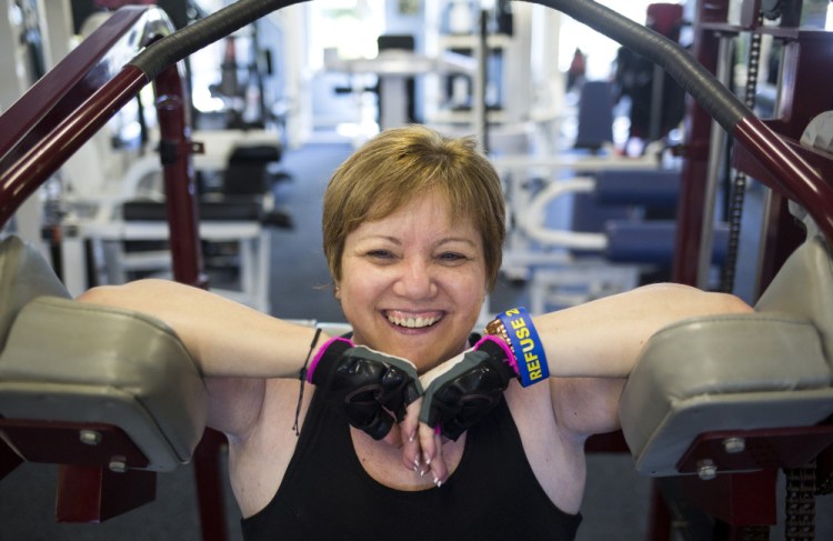 Charlene Ouellet of Brunswick, who is legally blind, takes a break at the gym where she trains. Ouellet, 53, is paying $21,000 for an experimental and controversial stem cell procedure by a doctor in Florida.