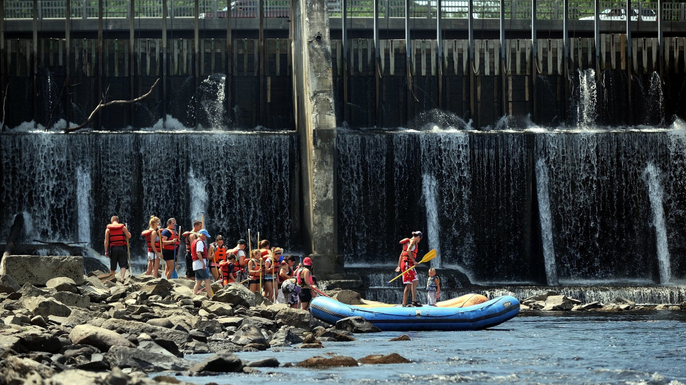 Rafters wait to board rafts operated by Moxie Outdoor Adventures for free rides down the Kennebec River in Skowhegan as part of a past River Fest. The annual event will draw attention to a $4.3 million proposal to create a white-water park in the Kennebec Gorge.
