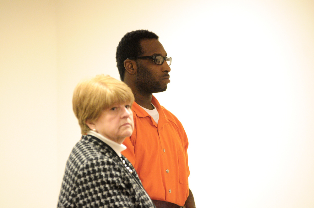 Defense attorney Pamela Ames stands with David W. Marble Jr. during a hearing in December 2015. Marble, who is being held on two counts of murder, pleaded no contest Wednesday to threatening a corrections officer.