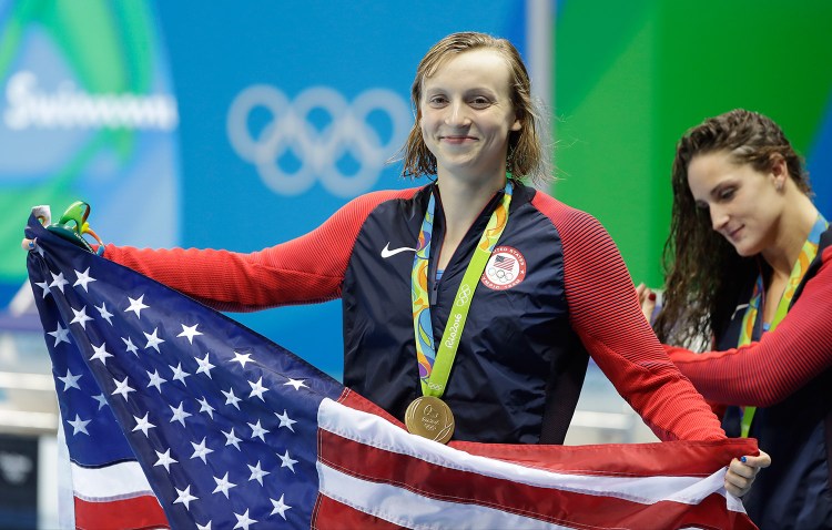 Katie Ledecky of the U.S. celebrates with her medal after the women's 400-meter freestyle during the swimming competitions at the 2016 Summer Olympics. Associated Press/Matt Slocum
