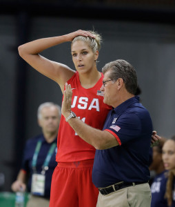 Guard Elena Delle Donne talks with head coach Geno Auriemma during the first half of a women's basketball game on Monday.