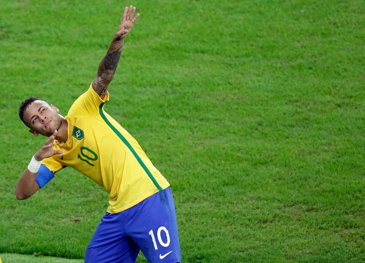 Brazil's Neymar celebrates after scoring his team's first goal on a free kick during the final match of the men's Olympic soccer tournament between Brazil and Germany at the Maracana stadium in Rio de Janeiro, Brazil, on Saturday. Brazil won in overtime on penalty kicks.