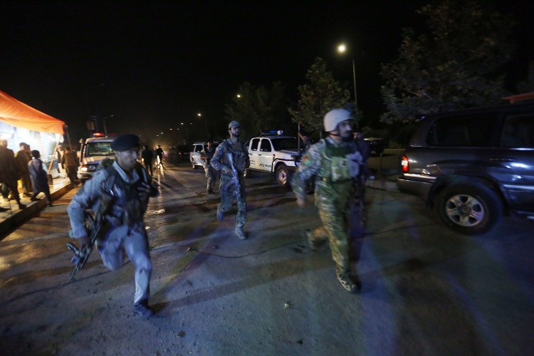 Afghan security forces rush to respond to a complex attack on the campus of the American University in the Afghan capital Kabul on Wednesday. 