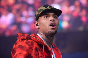 FILE - In this June 7, 2015, file photo, rapper Chris Brown performs at the 2015 Hot 97 Summer Jam at MetLife Stadium in East Rutherford, N.J. Authorities said officers responded to singer Brown's Los Angeles home early Tuesday, Aug. 30, 2016, after a woman called police seeking assistance. (Photo by Scott Roth/Invision/AP, File)