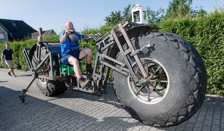 Frank Dose test drives his self-made bicycle in Rade, Germany. Markus Scholz/dpa via AP