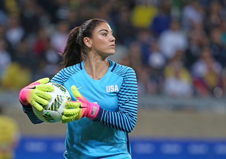 U.S. goalkeeper Hope Solo takes the ball during a match against New Zealand in Belo Horizonte, Brazil., on Aug. 3. U.S. Soccer says her comments about Sweden's team were "unacceptable and do not meet the standard of conduct we require from our National Team players." Eugenio Savio/Associated Press