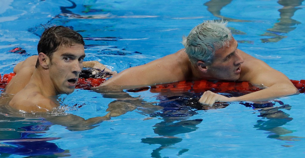 Michael Phelps, left, joins up with U.S. teammate Ryan Lochte after winning the gold medal Thursday night in the men's 200-meter individual medley. Lochte finished fifth.