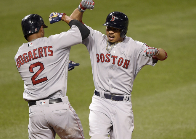 Boston's Mookie Betts celebrates his three-run home run with Xander Bogaerts during the fifth inning.    Associated Press/Nick Wass