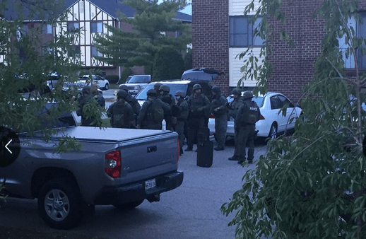 Police and fire officials respond to a "hazardous material incident" in the Olde English Village complex in South Portland on Sunday night. Courtesy WCSH TV