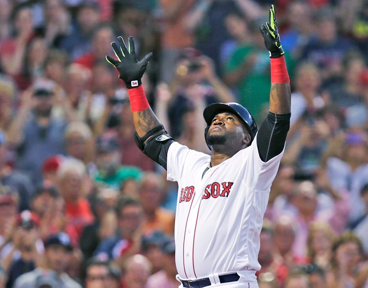 Red Sox designated hitter David Ortiz raises his arms as he crosses home plate after hitting a  three-run home run in a game against the Detroit Tigers last Tuesday. Charles Krupa/Associated Press