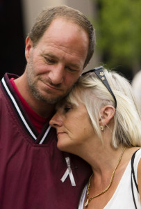 Jeff Wisse of Gorham comforts his girlfriend, Patricia Burnell of South Portland, as they reflect on the loss of three friends in the last six months to drug overdoses. Carl D. Walsh/Staff Photographer