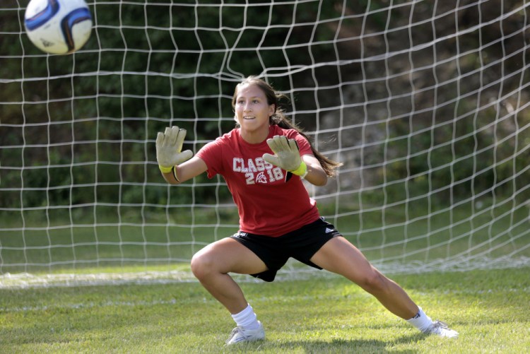 Niki Perez, a junior goalkeeper, keeps her eye on the ball as Sanford High prepares for the girls' soccer season. Sanford, which was once just another team, vaulted to contender status a year ago and graduated just two players.