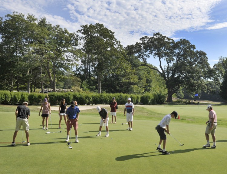 Members of the Cape Elizabeth golf team work on their putting at Purpoodock Golf Club's practice green one recent morning. Purpoodock tries to give plenty of access to junior players – the club's "future members."