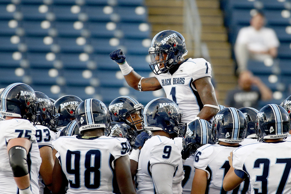 Najee Goode of UMaine fires up his teammates before they take on UConn in the season opener Thursday night at Rentschler Field in East Hartford, Conn.
