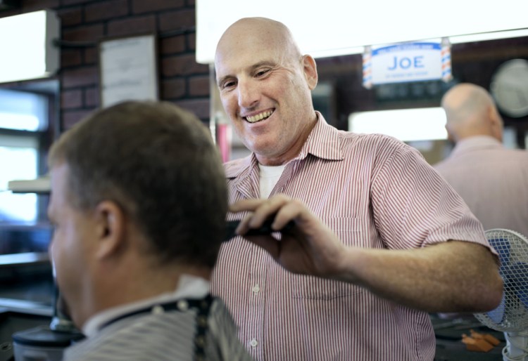 Joe Souza at his day job at Mill Creek Barber Shop in South Portland. His other job is writing, mostly horror and crime fiction. He has published eight books.