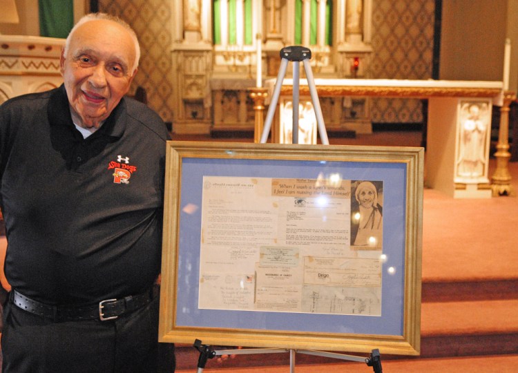 Ralph Ardito Sr. stands Friday with a framed thank-you letter from Mother Teresa at St. Mary's Church in Augusta. The soon-to-be saint wrote to Augusta's Knights of Columbus group in 1978 to thank it for a $1,000 donation.