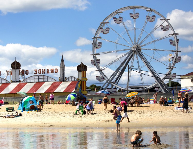 People enjoy a beautiful day in Old Orchard Beach. The dry weather was good for tourism last summer.