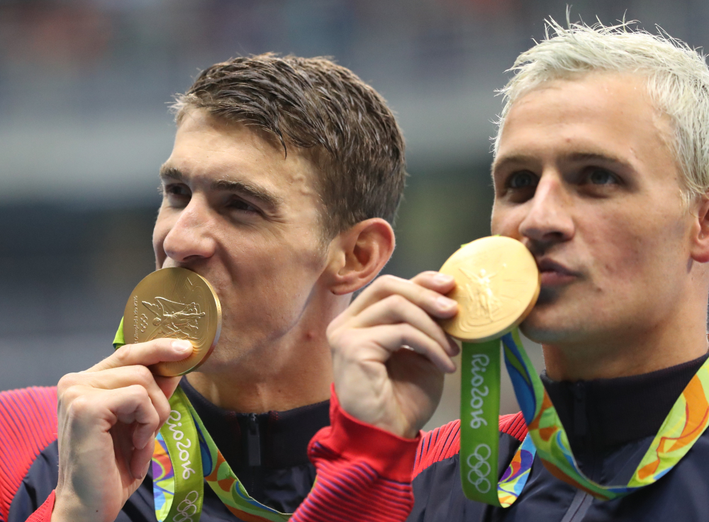 Michael Phelps, left, says he's too busy to show up and root for teammate Ryan Lochte on "Dancing With the Stars."