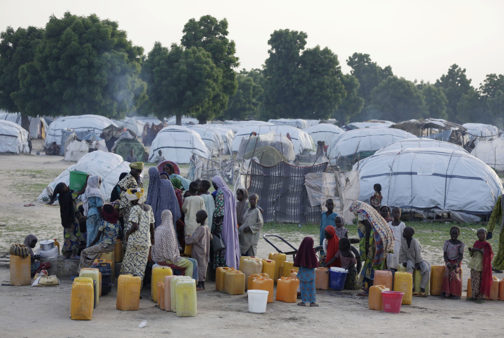 Displaced people in Maiduguri, Nigeria, fetch water. It's feared that polio will be found among ex-captives of Boko Haram.