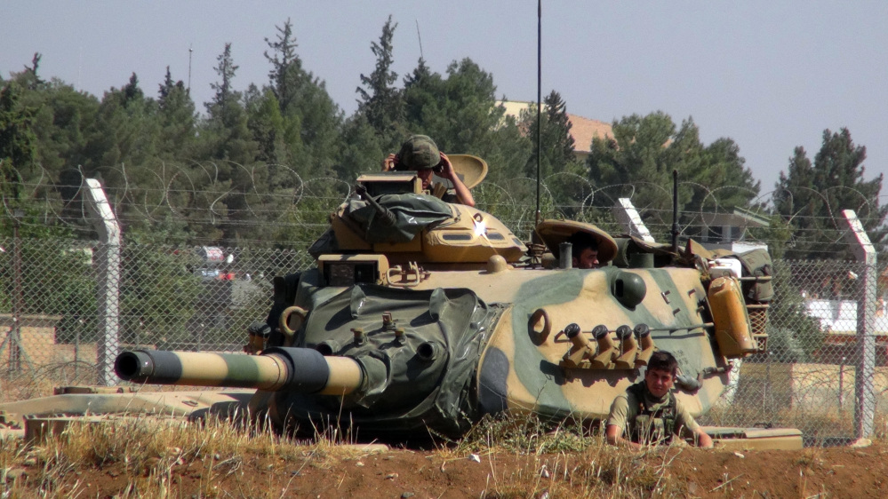 A Turkish army tank is stationed near the Syrian border, in Suruc, Turkey, on Saturday. Turkey's state-run news agency says Turkish tanks have entered Syria's Cobanbey district northeast of Aleppo in a "new phase" of the Euphrates Shield operation. Turkish tanks crossed into Syria Saturday to support Syrian rebels against the Islamic State group, according to the Anadolu news agency.