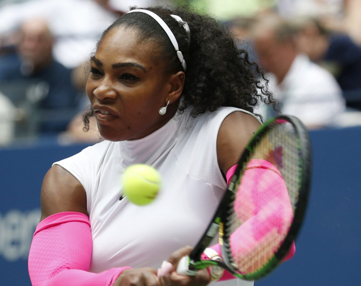 Serena Williams returns a shot to Johanna Larsson of Sweden while advancing Saturday to the fourth round of the U.S. Open with a 6-1, 6-1 victory.