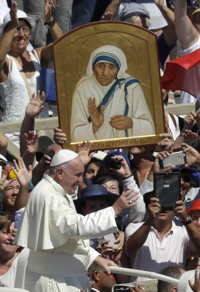 Pope Francis passes in front a portrait of Mother Teresa at the end of a canonization ceremony in St. Peter's Square at the Vatican on Sunday.
Associated Press/Alessandra Tarantino