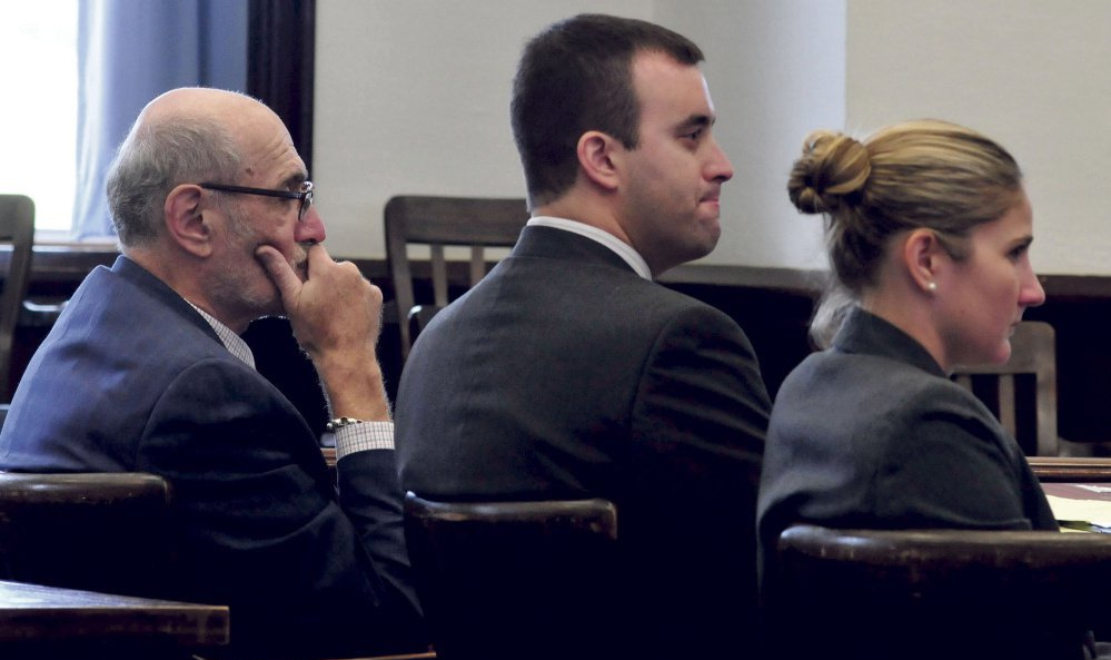 Andrew Maderios, center, and his attorneys, Leonard Sharon and Caleigh Milton, listen to the victim's statement at Maderios' sentencing hearing in Somerset County Superior Court. His appeal will be heard Sept. 14.