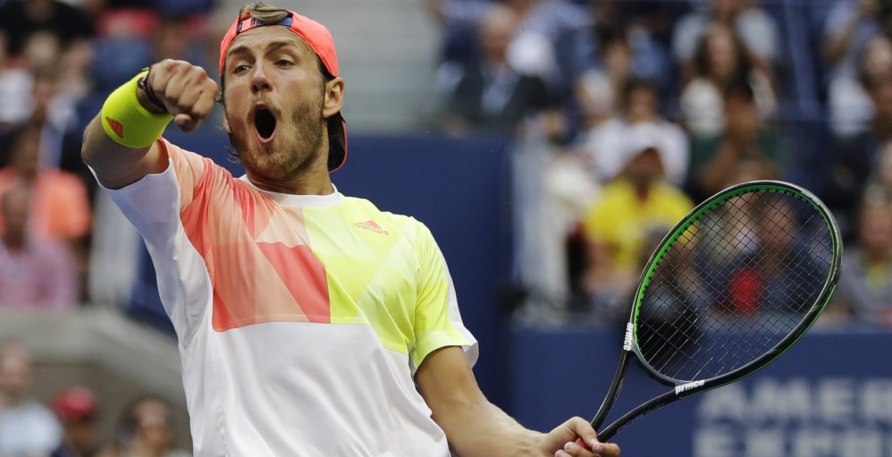 Lucas Pouille celebrates after breaking serve against Rafael Nadal in the fourth round of the U.S. Open. Pouille won in five sets, 6-1, 2-6, 6-4, 3-6, 7-6 .