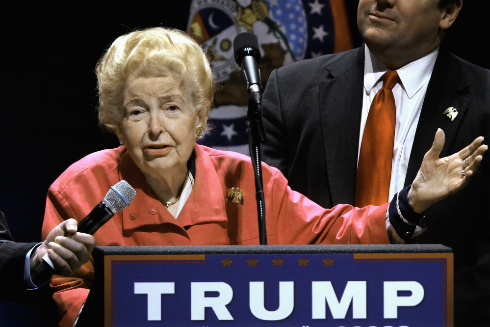 Phyllis Schlafly endorses Republican presidential candidate Donald Trump on March 11 before Trump begins speaking at a campaign rally in St. Louis. Schlafly, who founded the Eagle Forum political group, died Monday at the age of 92.