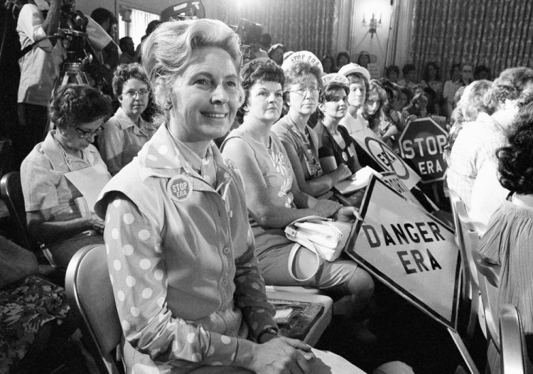 Women opposed to the Equal Rights Amendment sit with Phyllis Schlafly, left, national chair of Stop ERA, at a hearing of a Republican platform subcommittee on Aug. 10, 1976, in Kansas City, Mo. Schlafly helped defeat the Equal Rights Amendment.