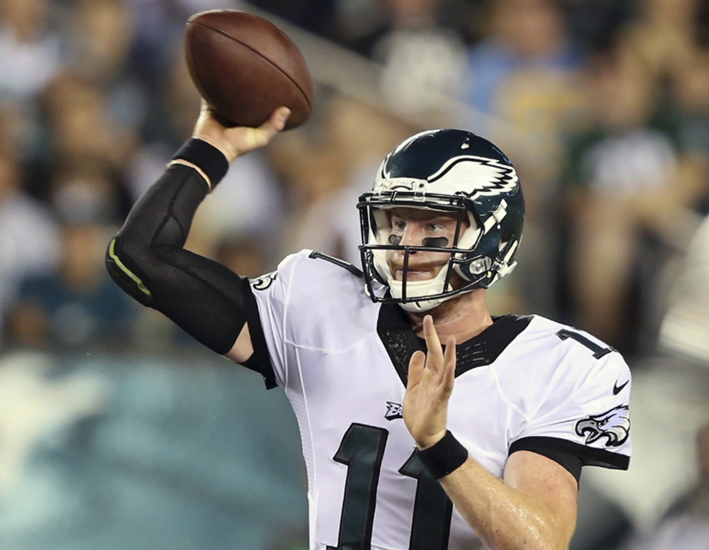 The Philadelphia Eagles traded up twice in the draft to pick quarterback Carson Wentz, who took a star turn in Week 1.