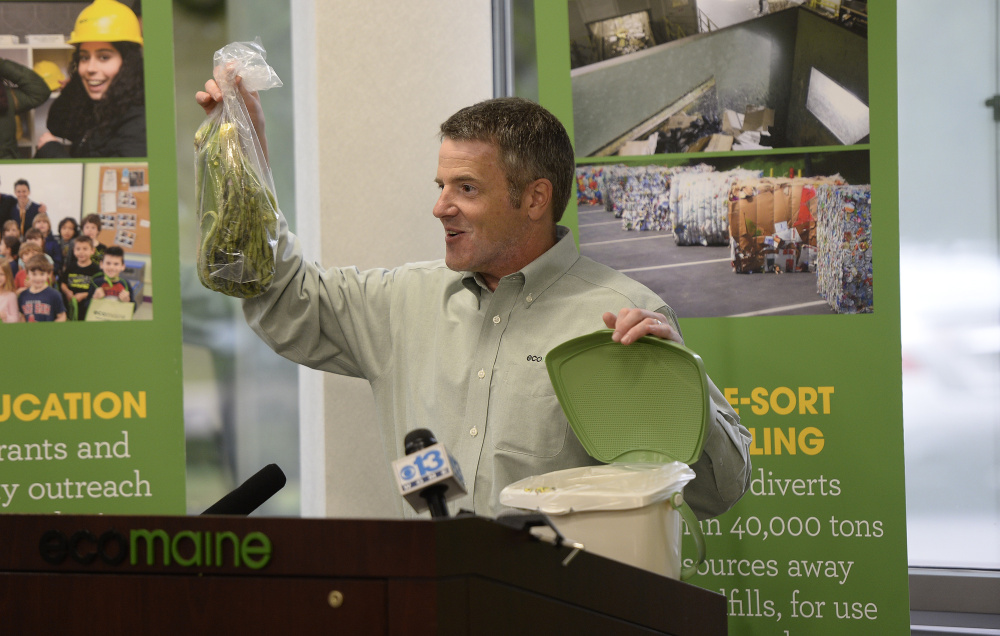 Ecomaine CEO Kevin Roche demonstrates how the food waste program will work at the source. The program will open the door for cities and towns to offer food waste collection.