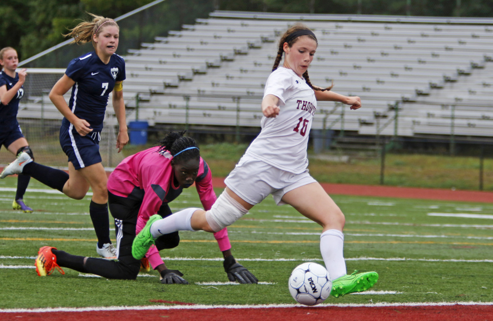 Hannah Niles of Thornton Academy breaks through to score her second goal in a three-minute span during the second half Wednesday, getting past Reilley Joyce and goalie Nyagoa Bayak of Westbrook during Thornton's 3-0 victory in girls' soccer at Saco.