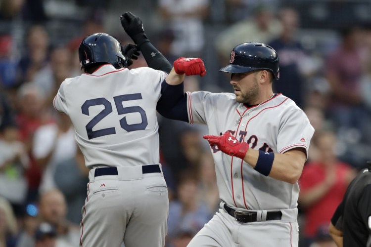 Boston's Travis Shaw, right, celebrates with Jackie Bradley Jr. after hitting a two-run home run hit against the San Diego Padres in the second inning Wednesday night in San Diego.